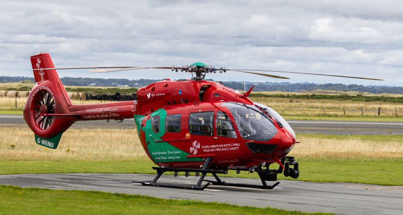 Caernarfon aviation Photography showcasing a single red helicopter on landing pad